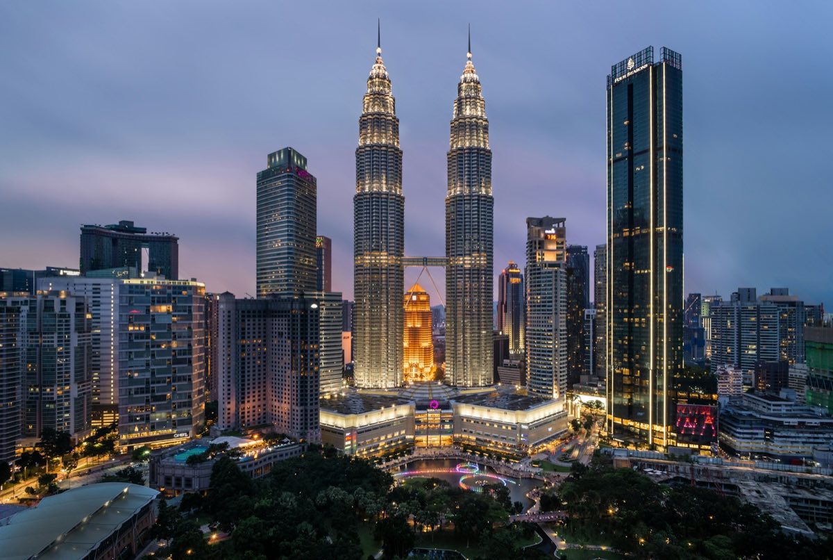 Petronas Twin Towers and KLCC at dusk — AITraining2U runs HRDC-claimable AI training in Kuala Lumpur